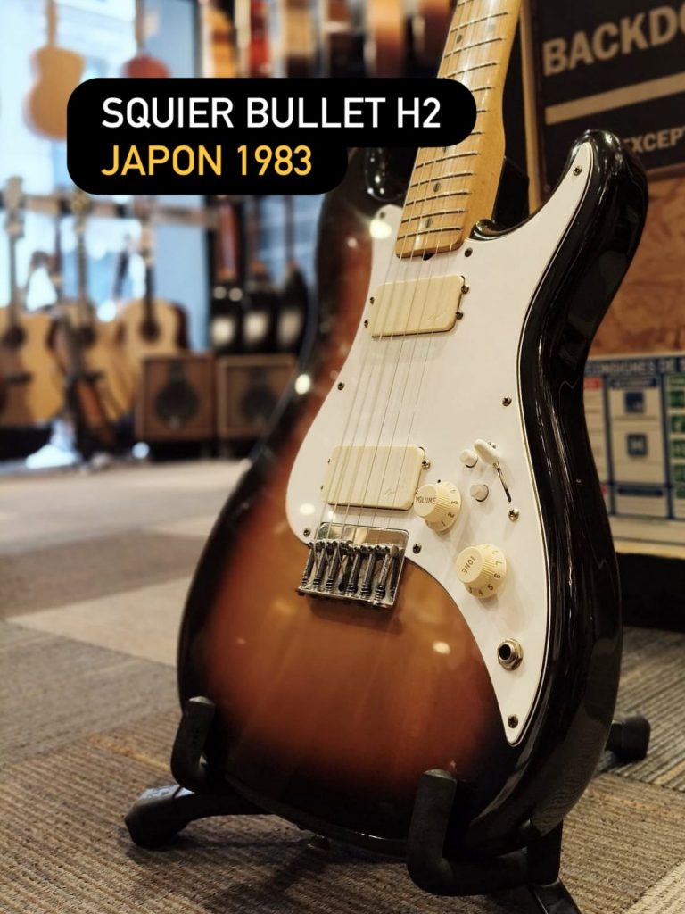 Squier Bullet H-2 Japan 1983 — une vraie pièce de début de série “SQ”, fabriquée chez Fujigen, avec deux humbuckers pour un son plus costaud. Format compact, finition sunburst… disponible chez Guitar Street.